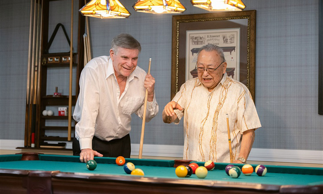 two men playing pool