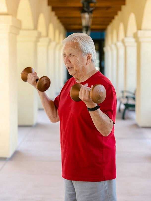 Senior gentleman doing weight training